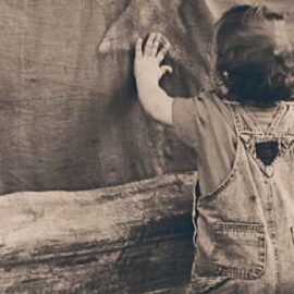 A boy leaning on the Wall A boy leaning on the Wall